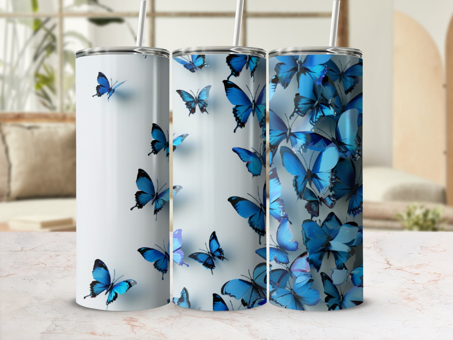 White tumbler with scattered blue butterflies and straw.