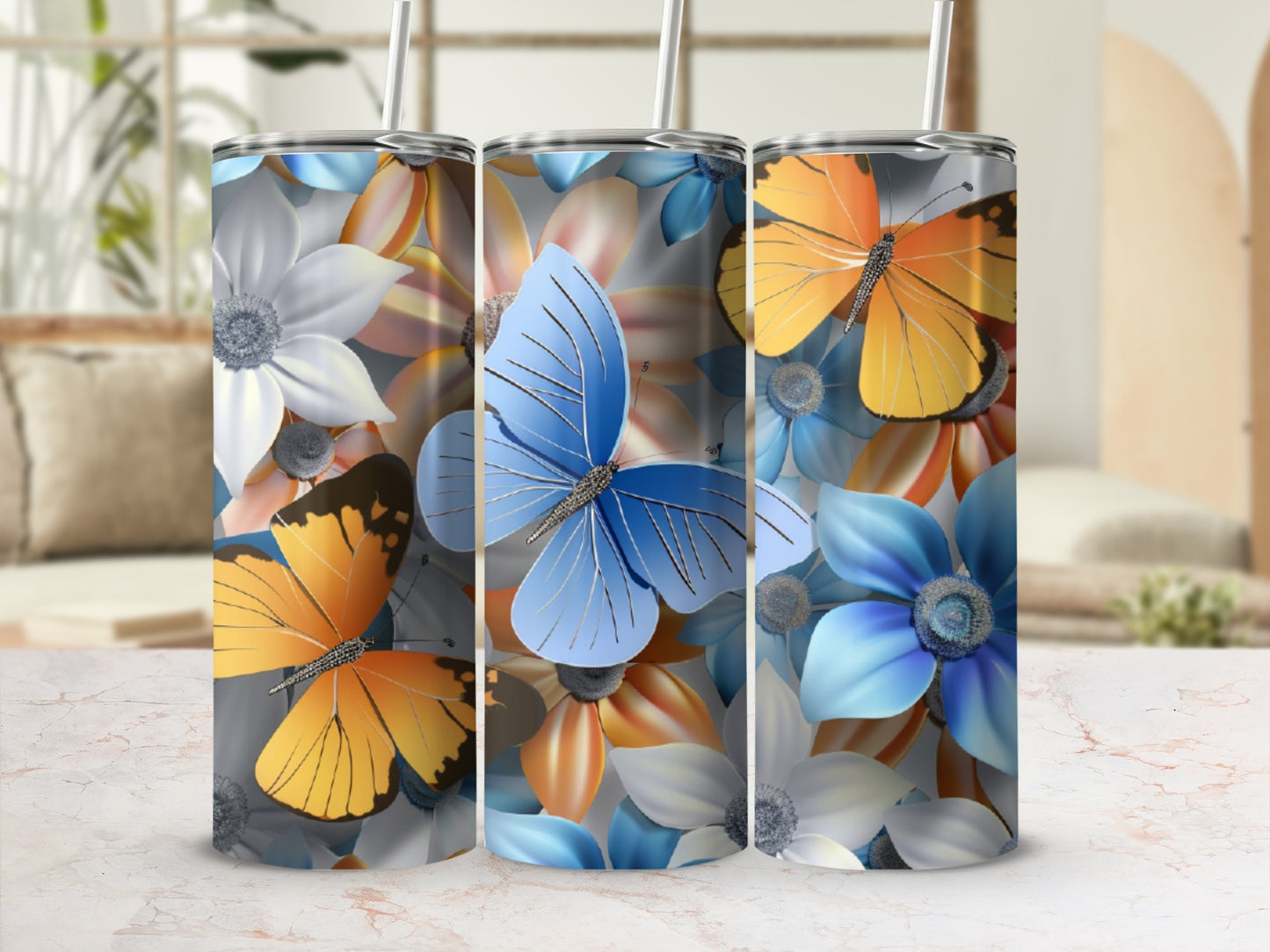Tumblers with blue, orange, and white flowers and butterflies.