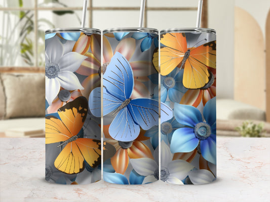 Tumblers with blue, orange, and white flowers and butterflies.