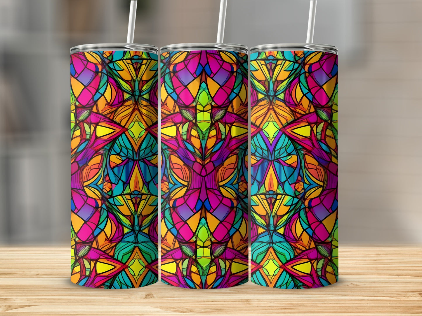Three tall tumblers with a vibrant, stained-glass-like abstract pattern.