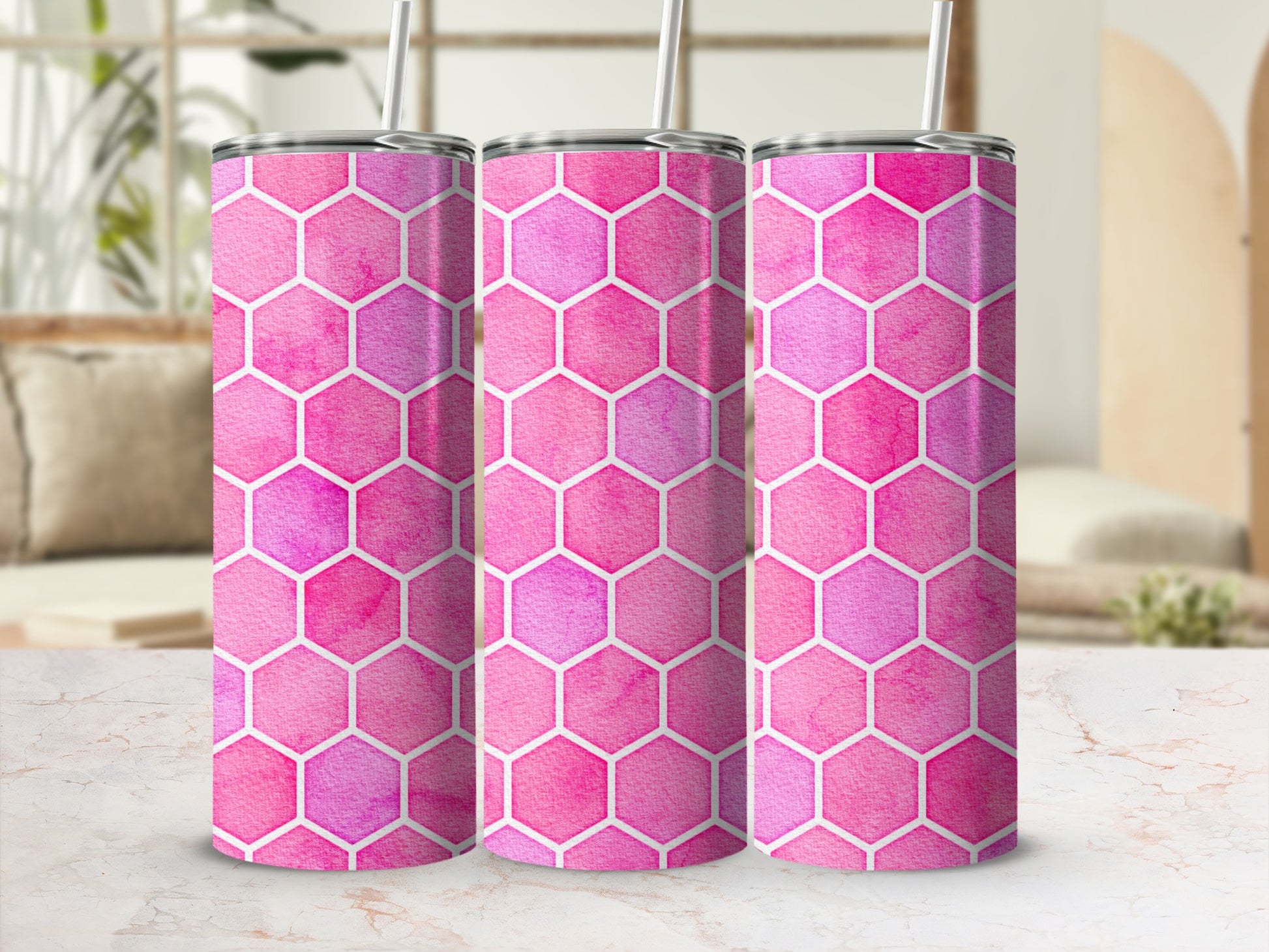 Three tumblers with pink and purple watercolor honeycomb pattern.
