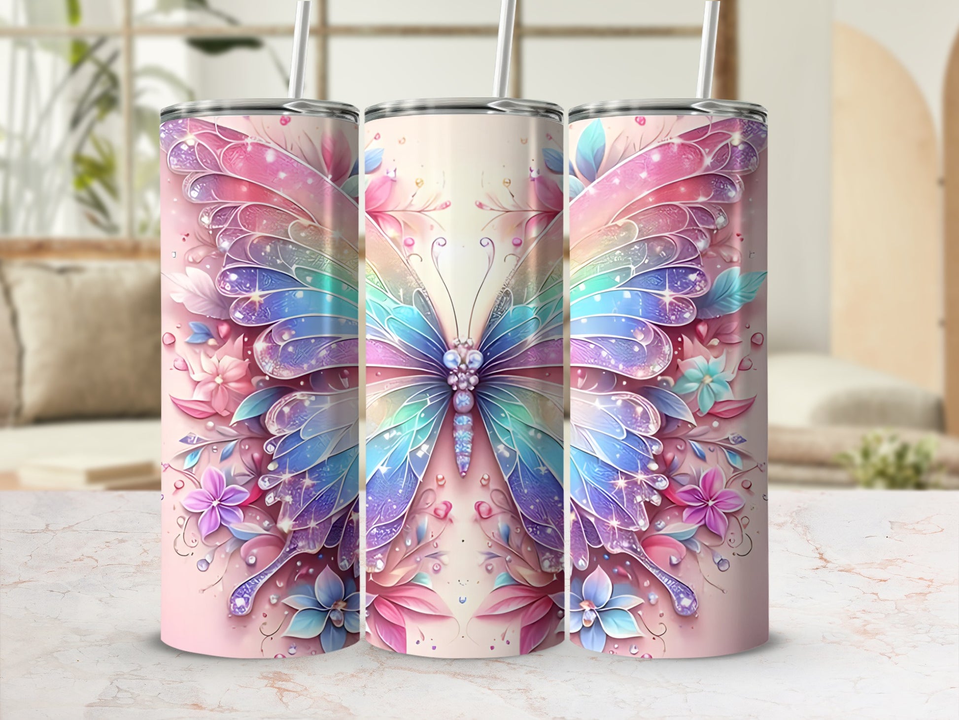 Three tumblers decorated with colorful butterfly and floral designs.