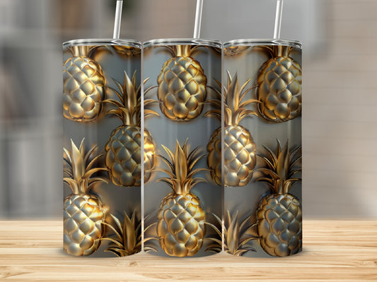 Three tumblers with a repeating gold pineapple pattern on a wooden surface.