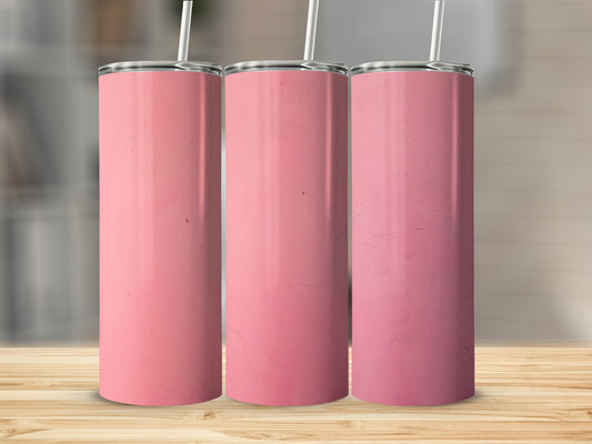 Three pink tumblers with straws on a wooden surface.