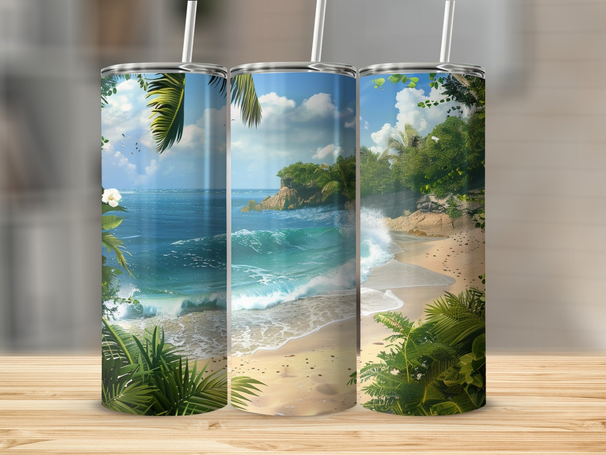 Tropical beach scene with turquoise waves and lush green foliage on three tumblers.