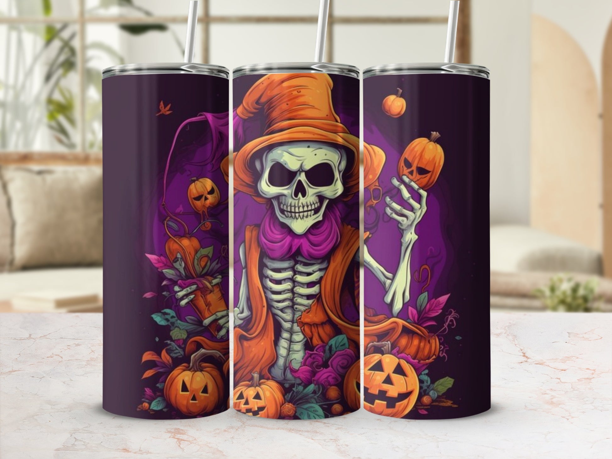 Three tumblers with a Halloween skeleton holding pumpkins design.