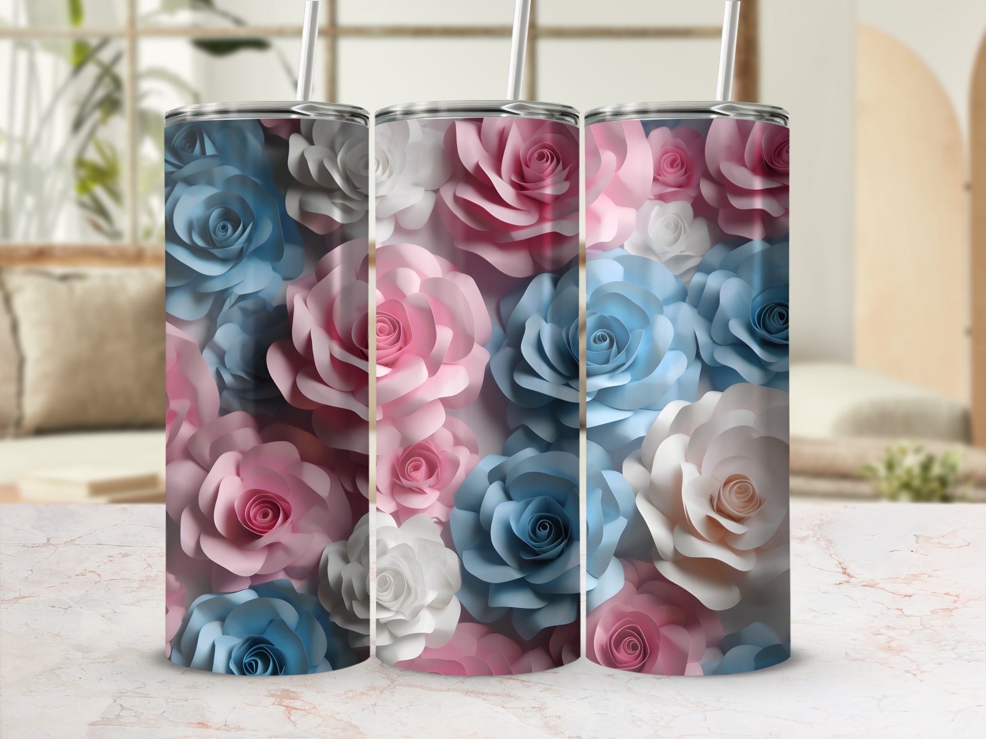 Three tumblers with a floral pattern of pink, blue, and white roses.