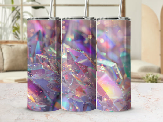 Three tumblers with iridescent crystal-like patterns on a marble surface.
