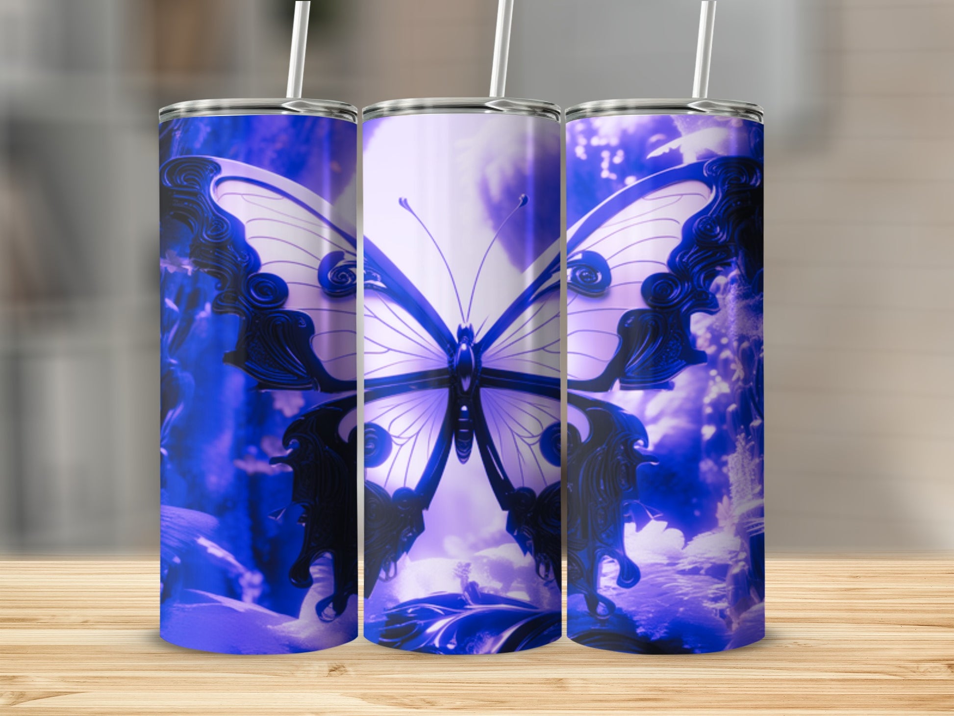 Three tumblers featuring a purple butterfly design on a wooden surface.