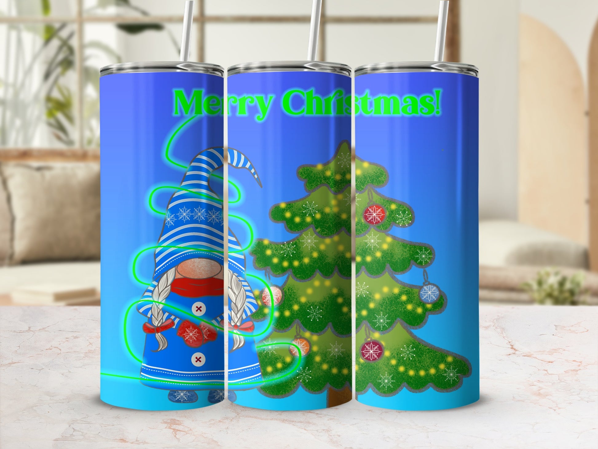 Blue tumbler with gnome and Christmas tree design and "Merry Christmas!" text.