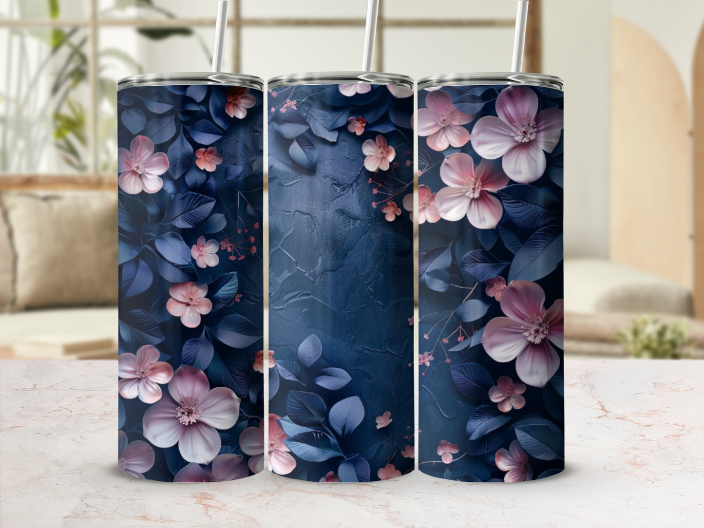 Three tumblers with navy blue and pink floral design.