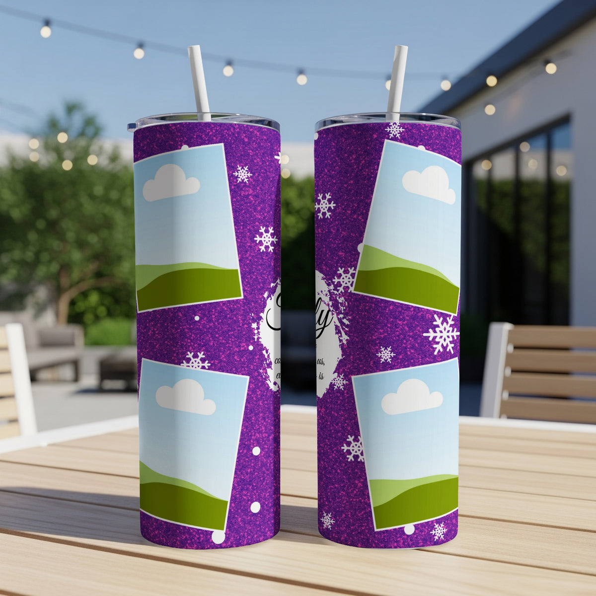 Purple tumblers with photo frames, snowflakes, and text on an outdoor table.