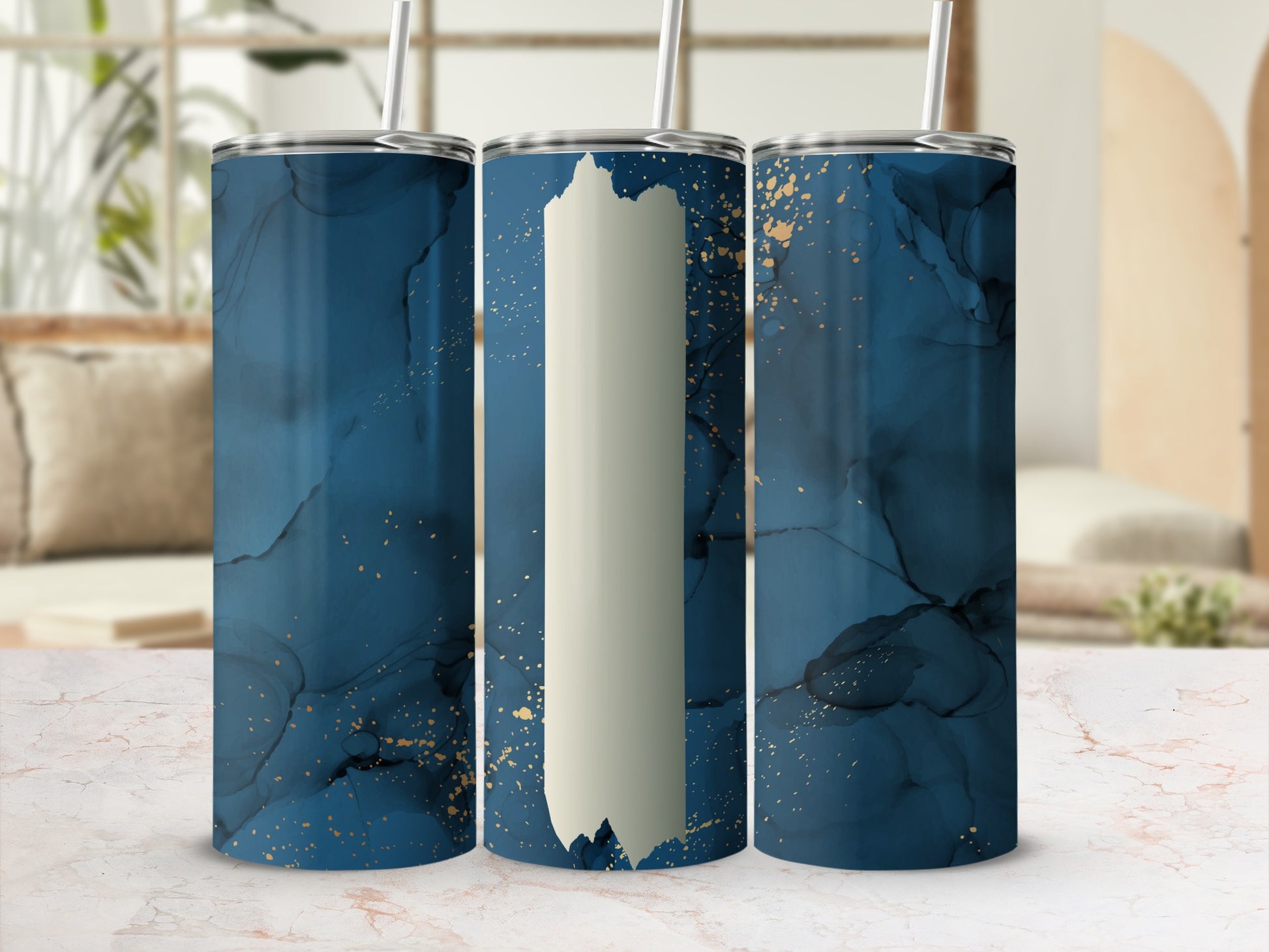 Blue marble and gold tumbler with straw, blank panel for personalization.