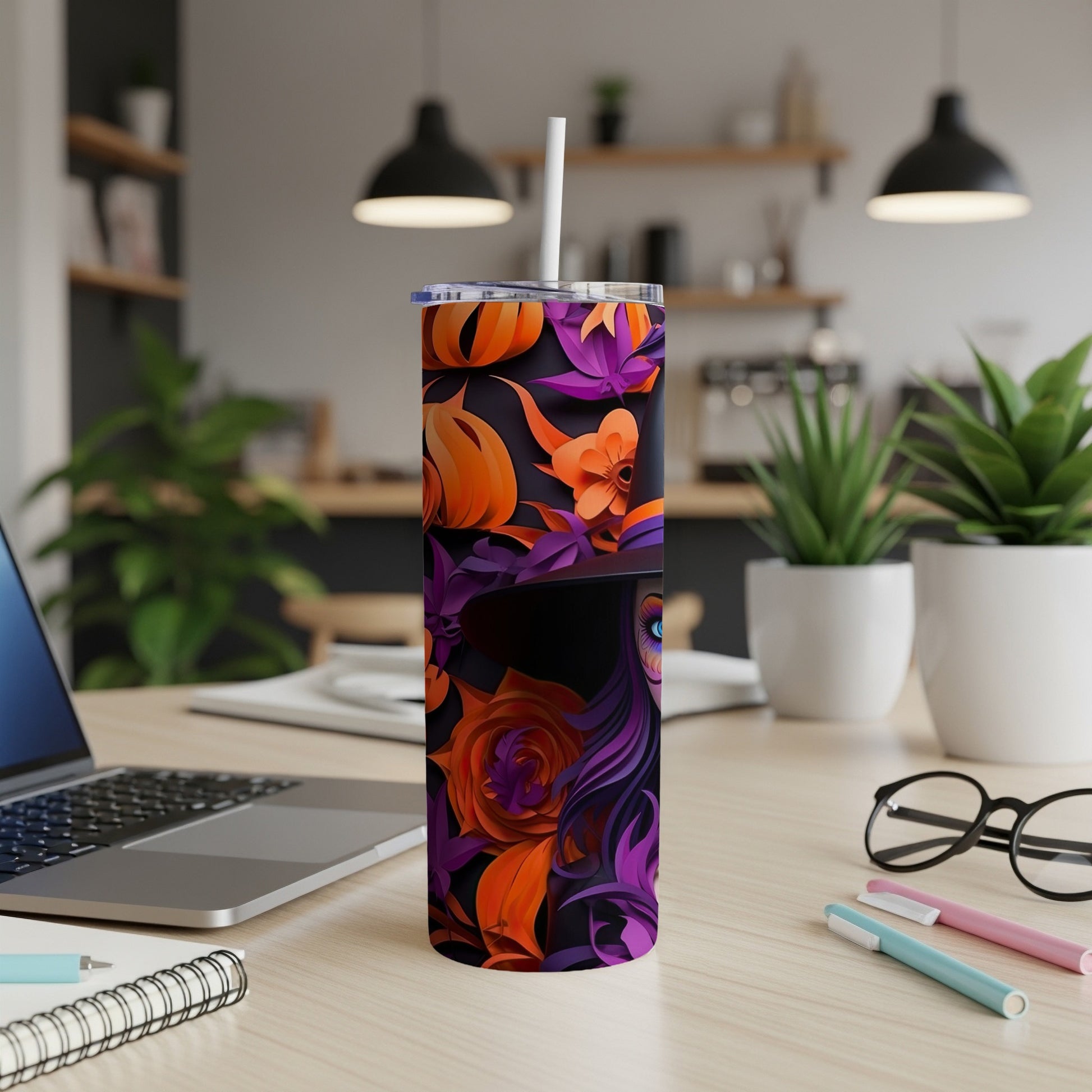Tumbler with witch and Halloween floral pattern featuring pumpkins, roses, and leaves.