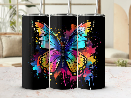 Black tumbler with vibrant rainbow butterfly and paint splatter design.