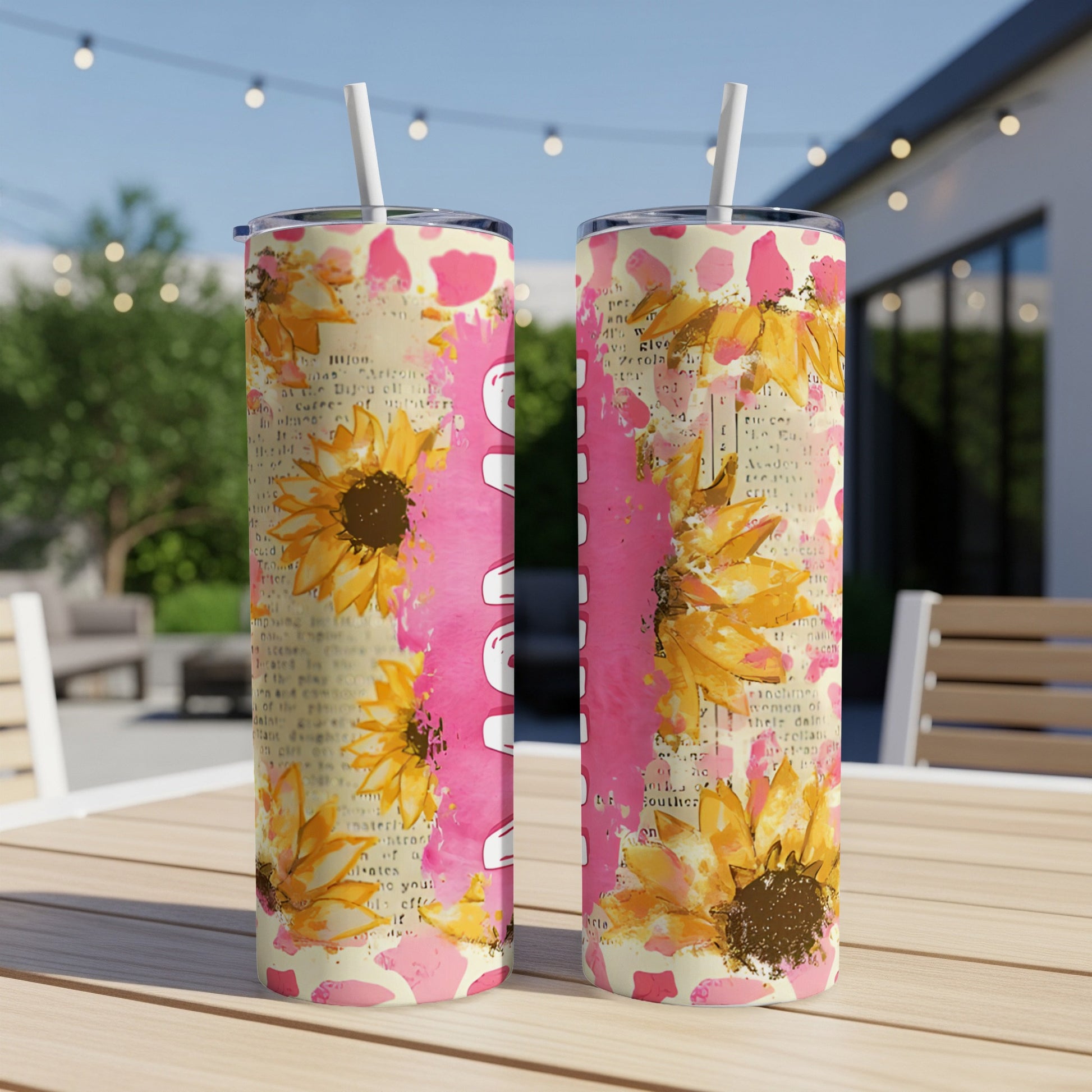 Two tumblers with pink and yellow sunflower design, featuring faded text.