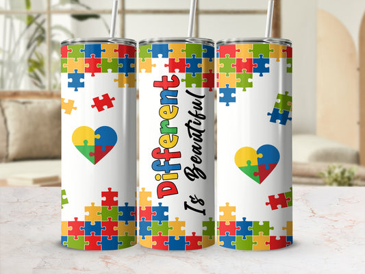 Tumbler with autism puzzle heart design and "Different Is Beautiful" text.