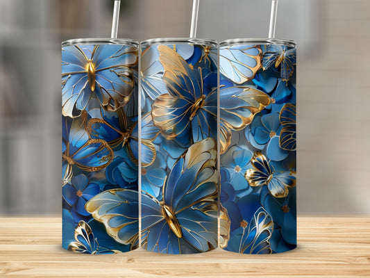 Three blue and gold butterfly-patterned tumblers with straws.