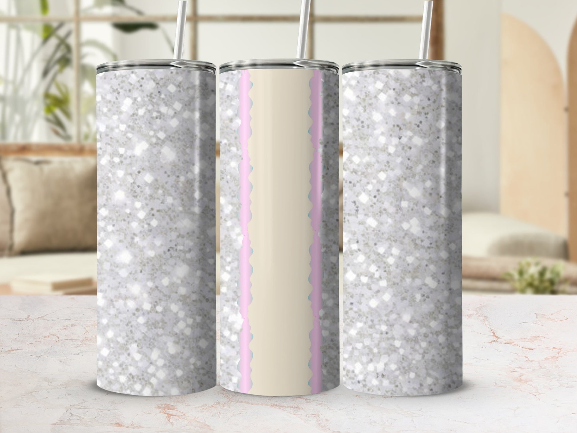 Three glitter-covered tumblers with pink scalloped trim, one in the center.