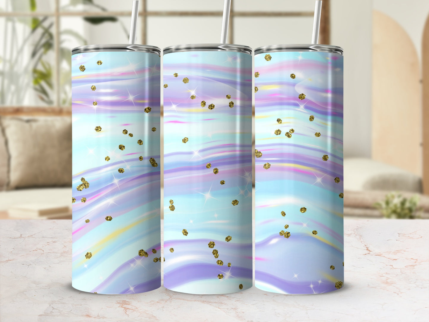 Three tumblers with a pastel, swirled design and gold glitter accents.