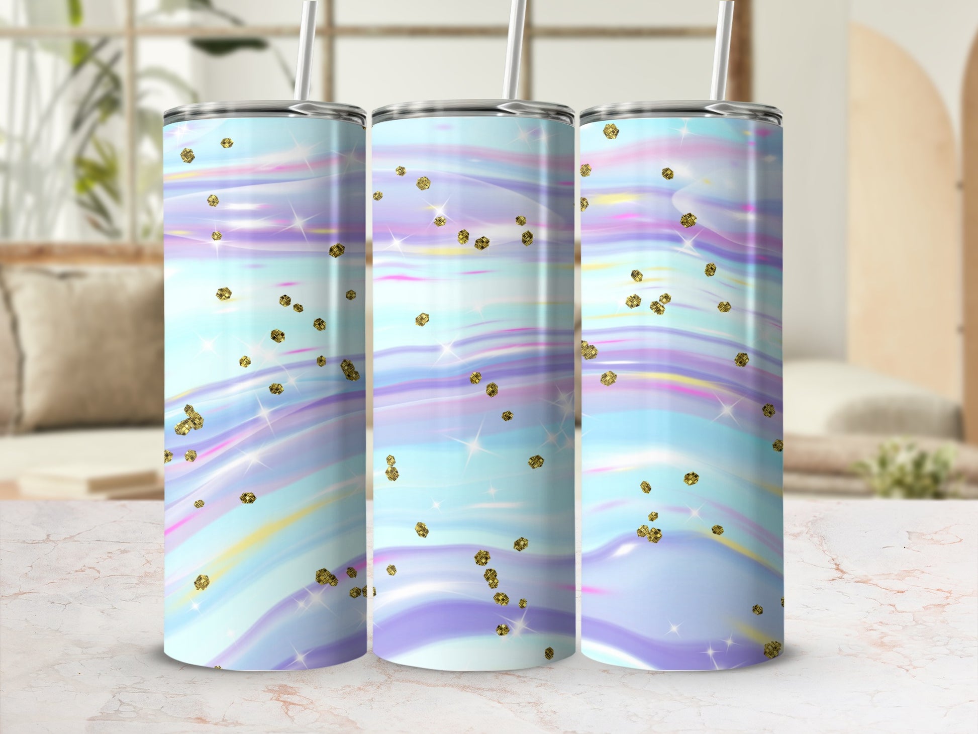 Three tumblers with a pastel, swirled design and gold glitter accents.