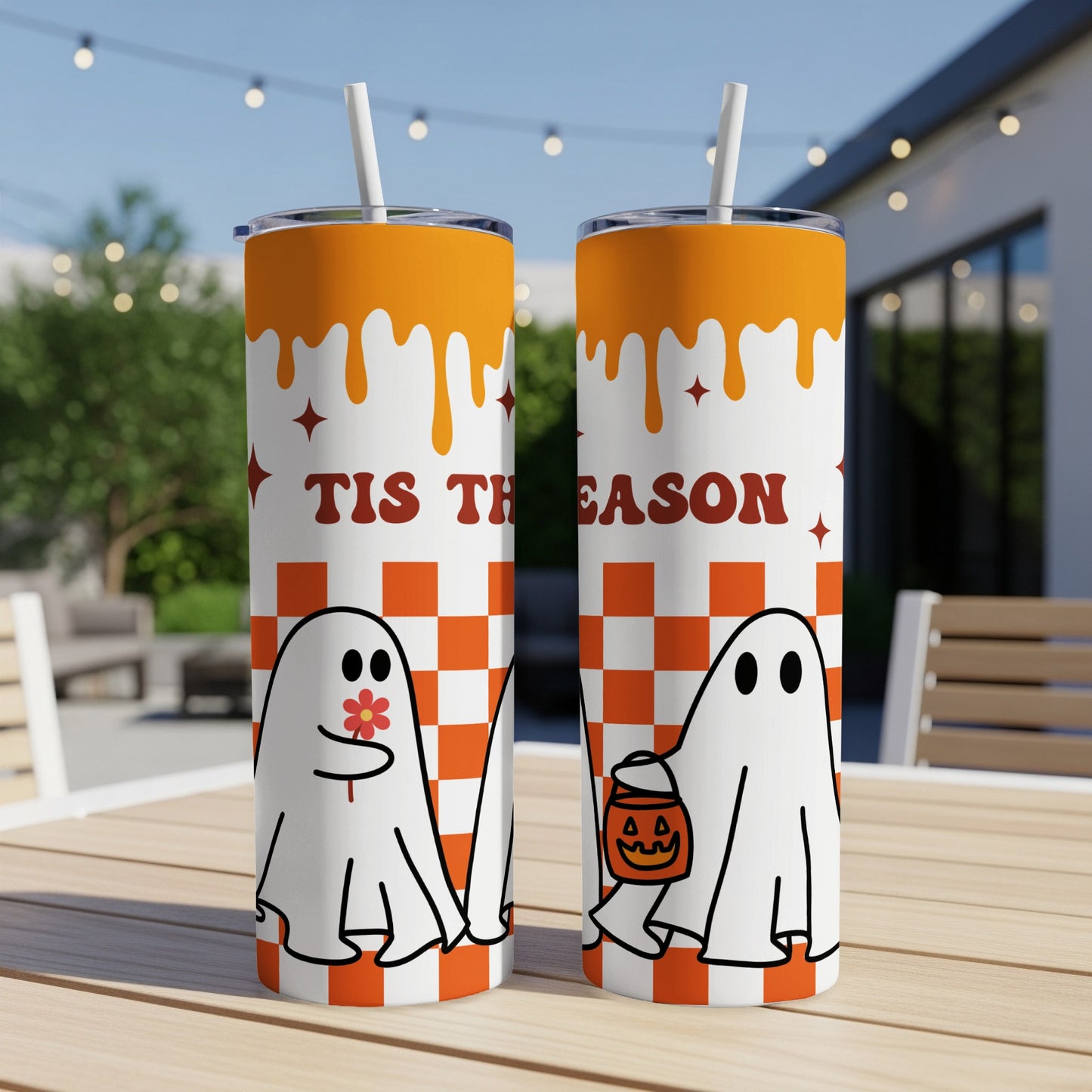 Two tumblers with ghosts, candy, and text "Tis The Season" on a checkered pattern.