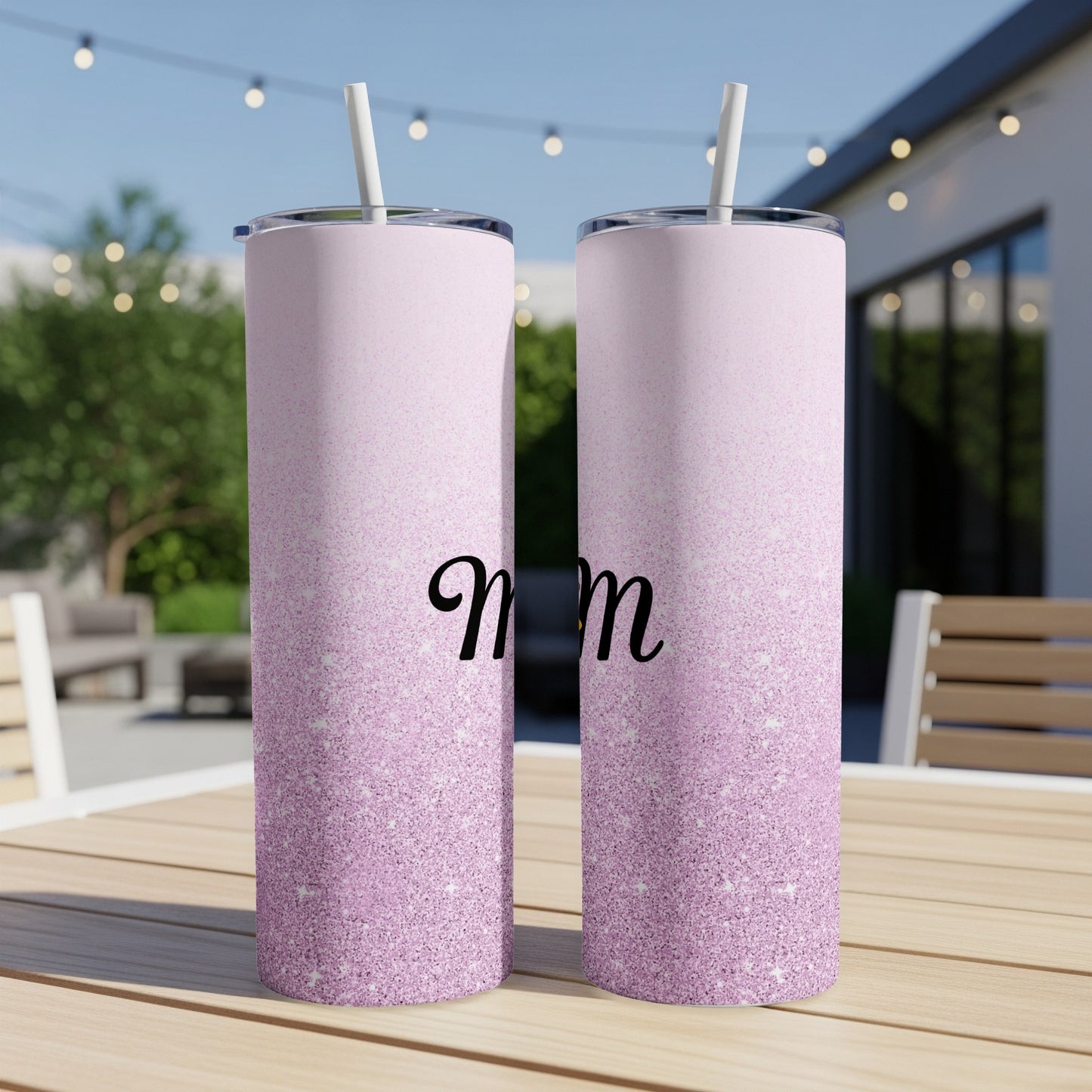 Pink glitter tumbler with "Mom" in script font and straw.