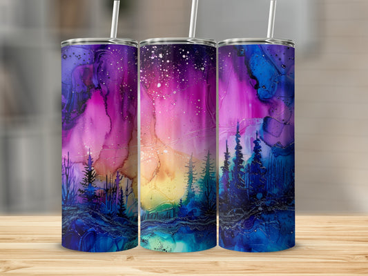 Three tumblers with a vibrant galaxy and forest design.