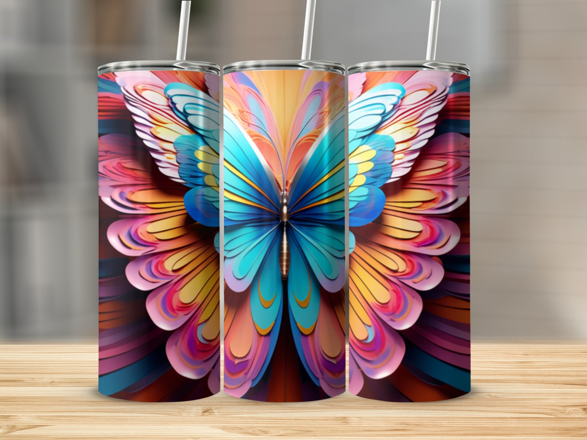 Three tumblers featuring a colorful, abstract butterfly design.