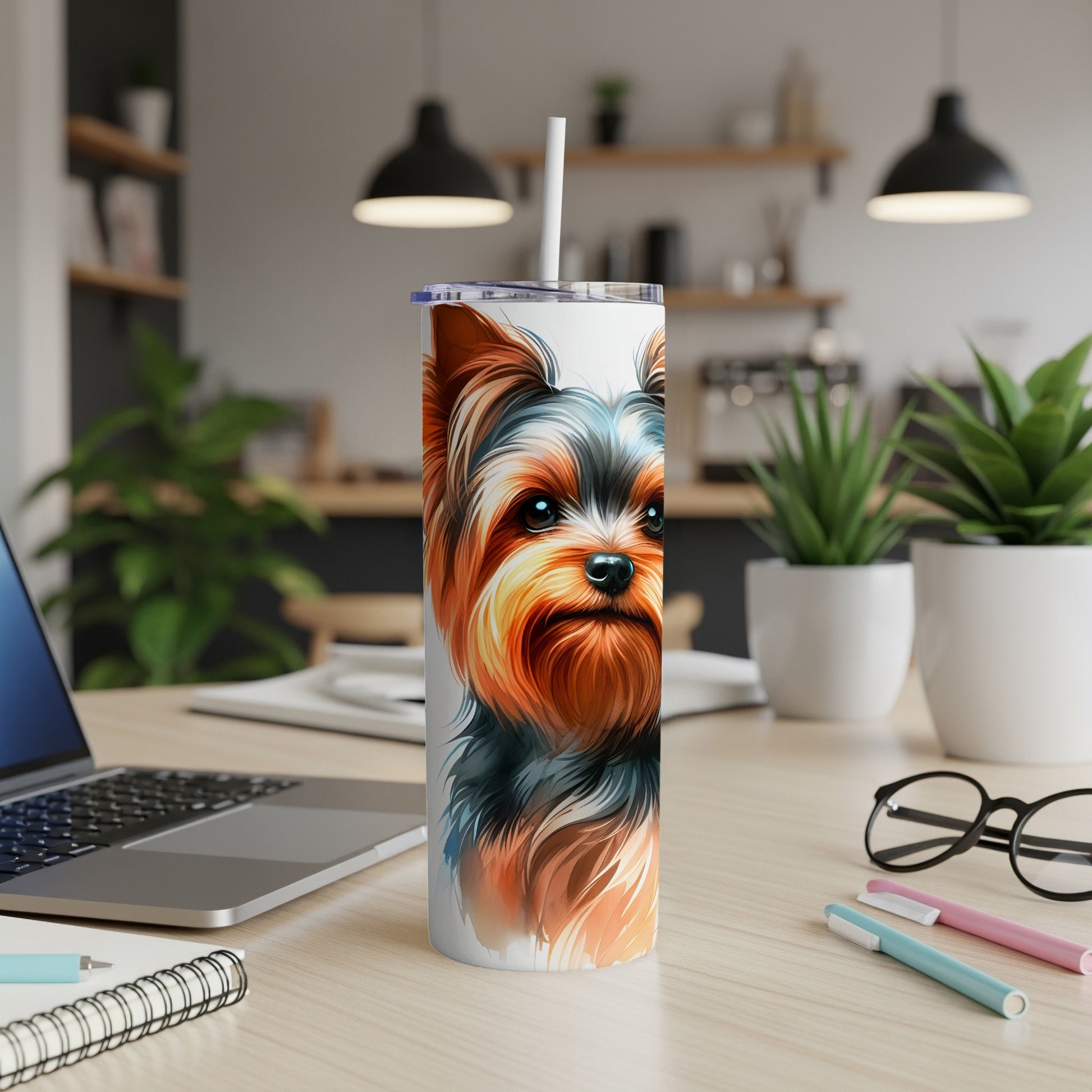 Yorkshire Terrier portrait on white tumbler with straw, on a desk.