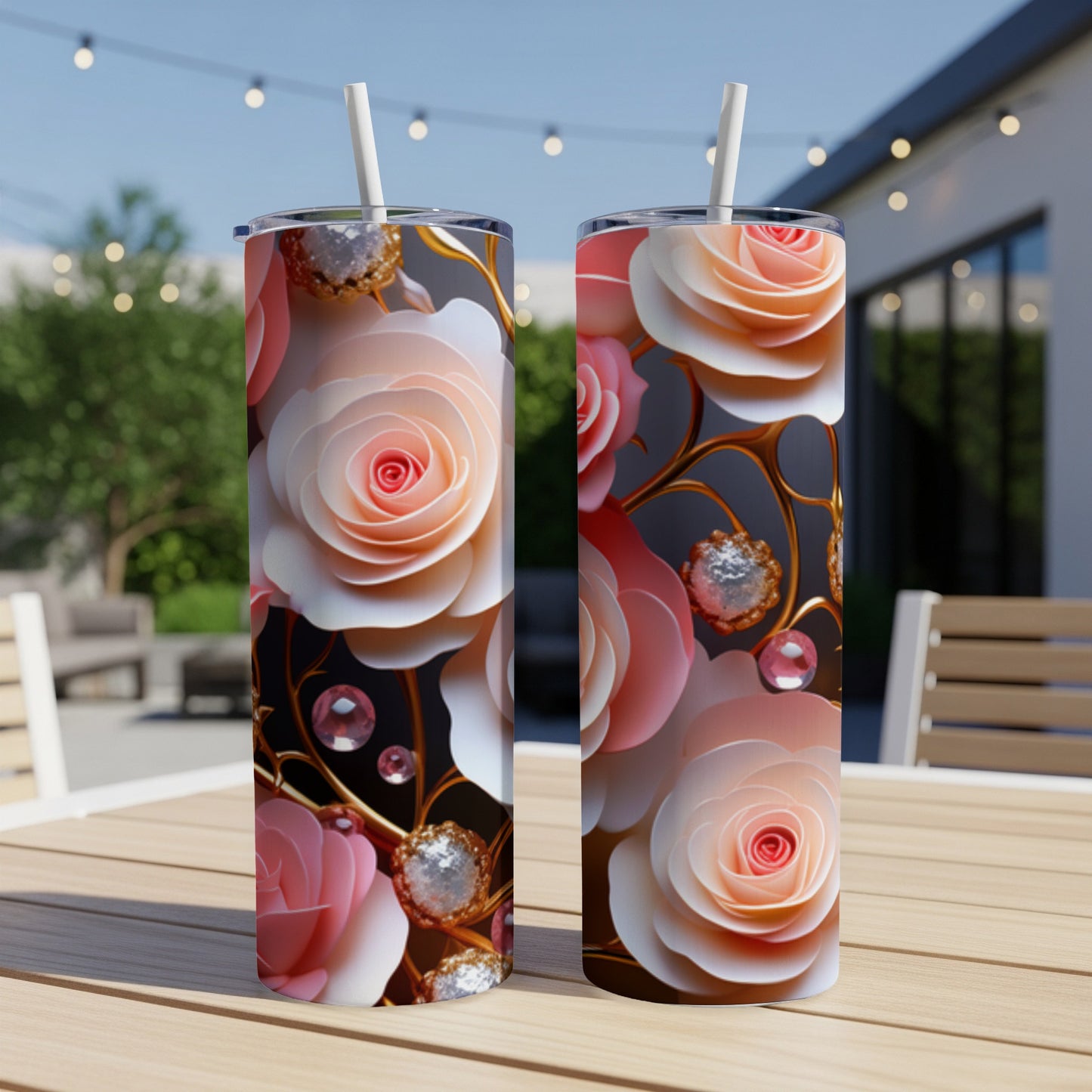 Two pink and peach floral tumblers with jeweled accents on a table.