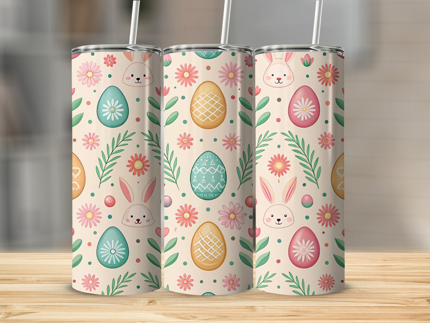 Three Easter-themed tumblers with bunnies, eggs, and flowers.