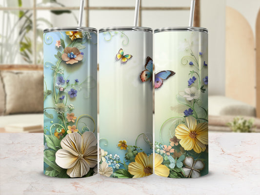 Three tumblers with floral and butterfly designs and light blue backgrounds.