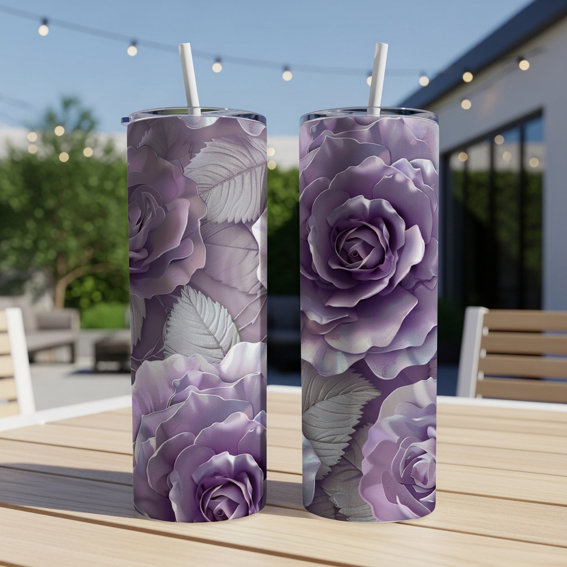 Two purple rose tumblers with straws on a wooden table outdoors.