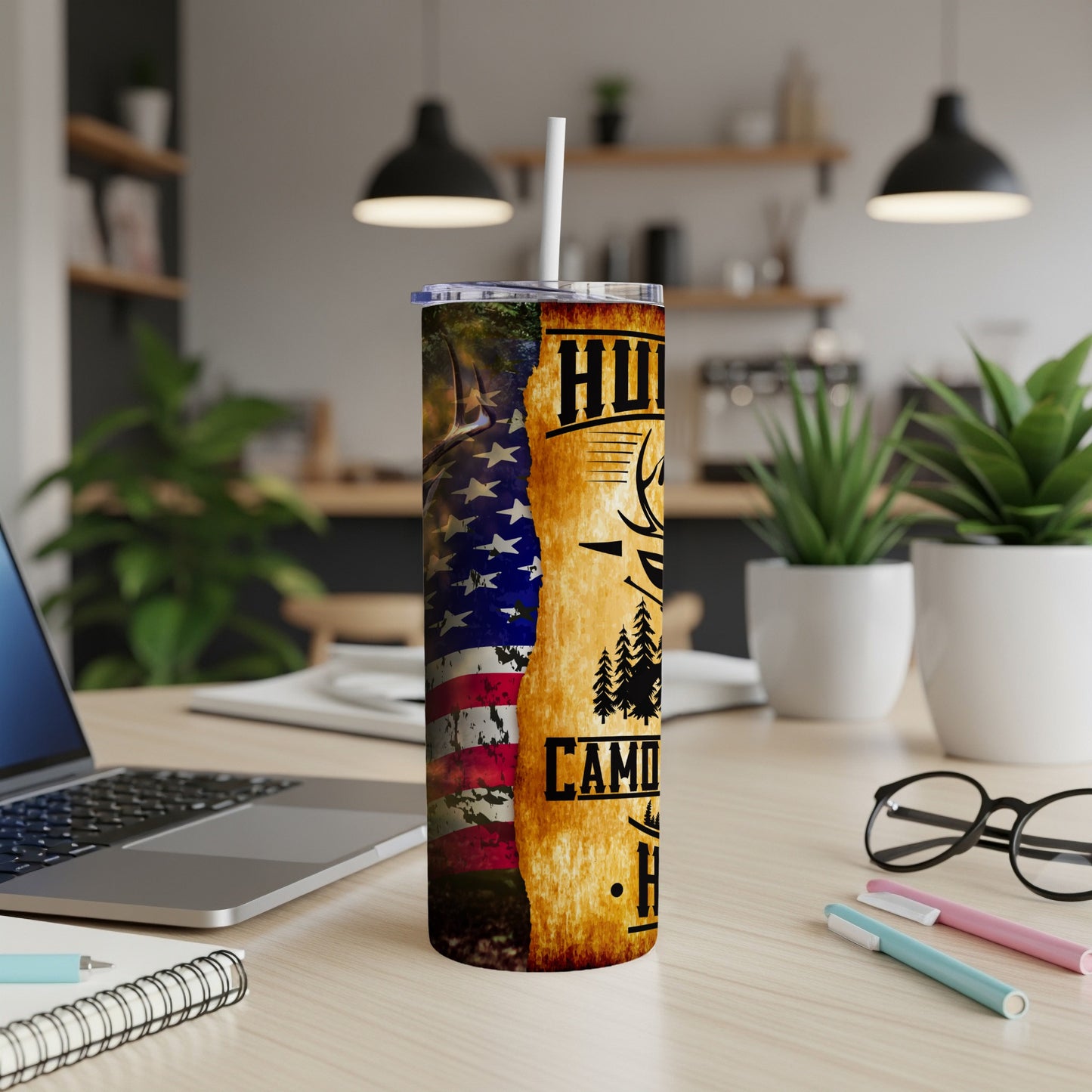 American flag and woods design on a stainless steel tumbler with straw.
