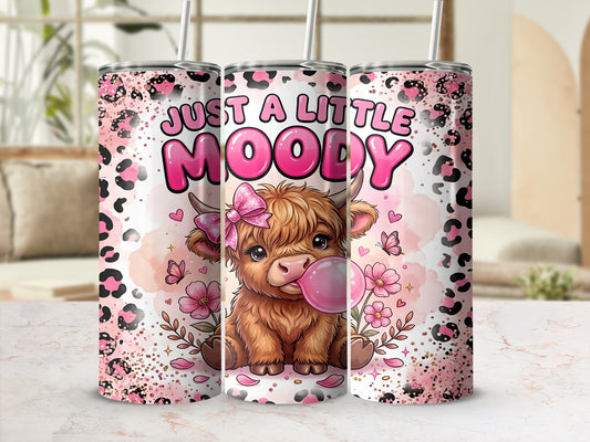 Highland cow with "JUST A LITTLE MOODY" text on a pink leopard print tumbler.