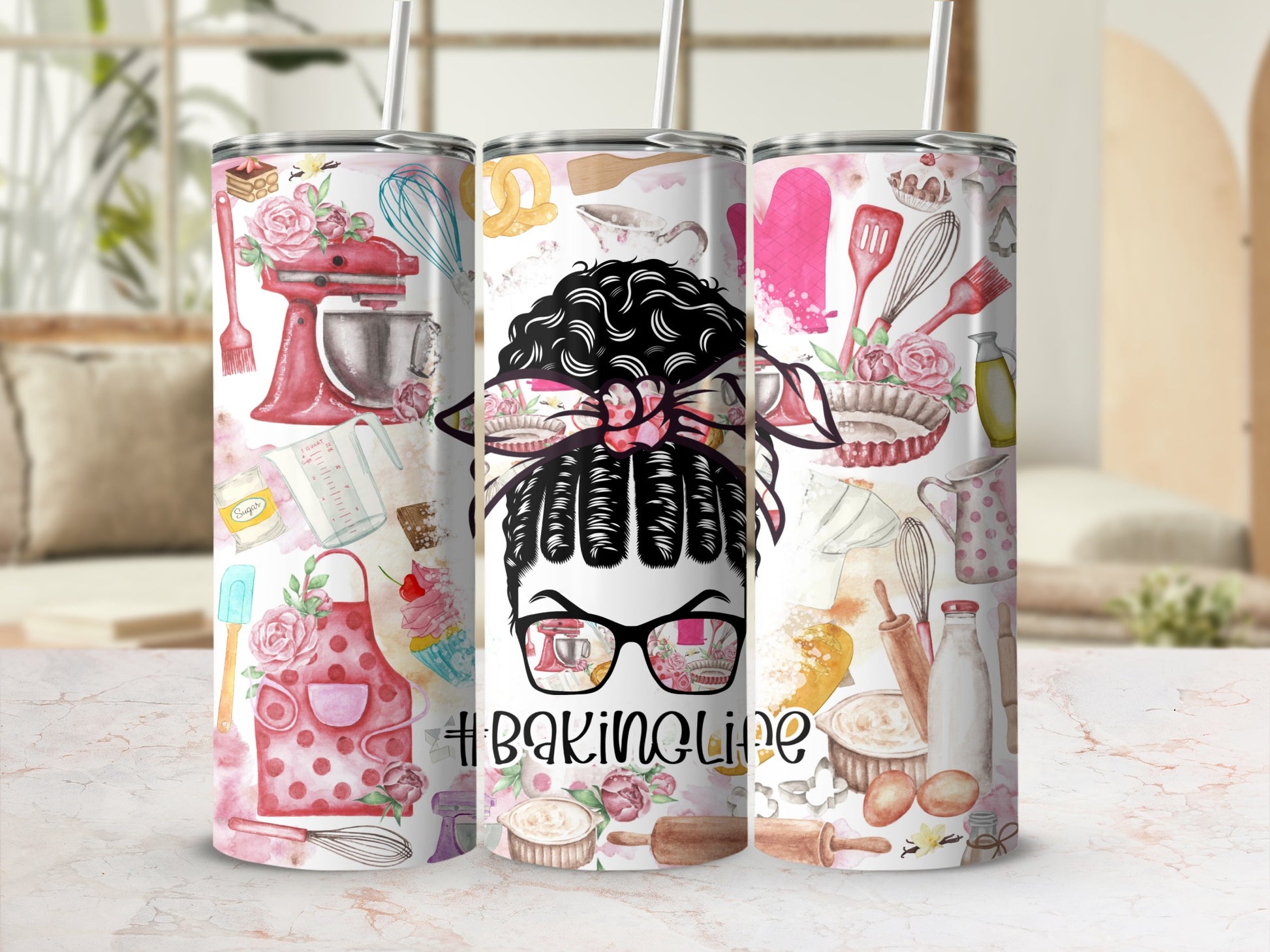 Woman with messy bun wearing glasses, surrounded by baking ingredients and tools.