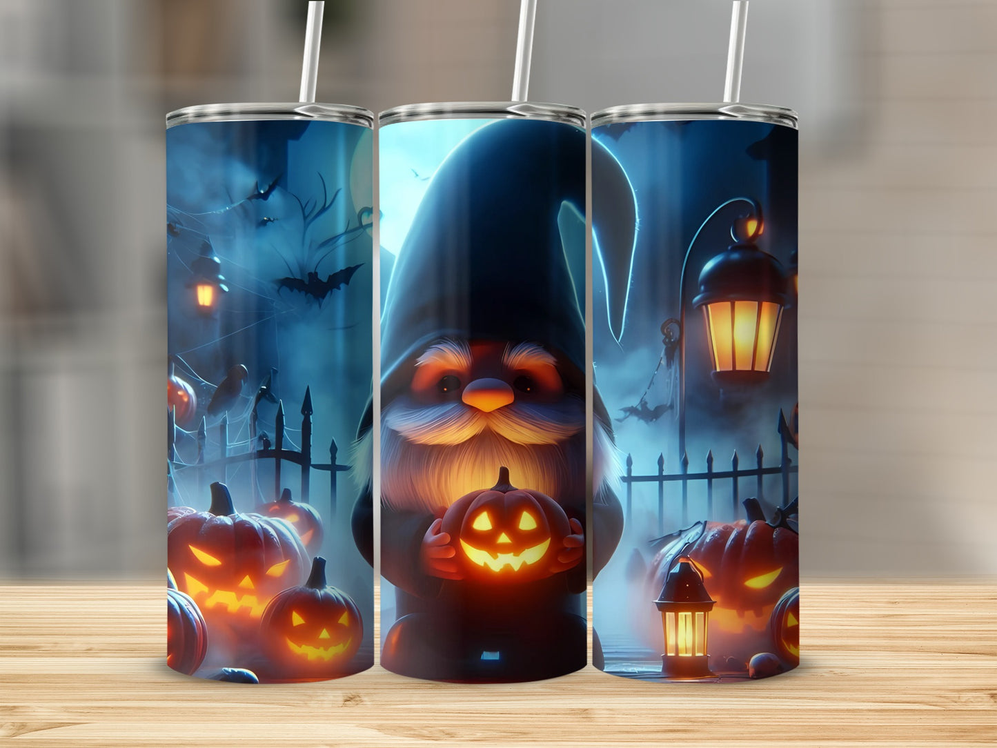 Three tumblers with Halloween theme art of a gnome holding a pumpkin.