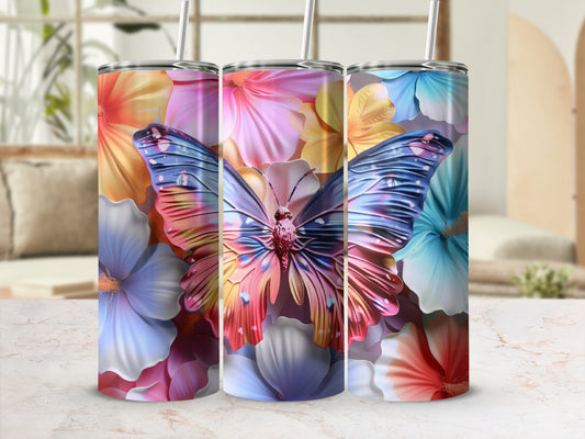 Butterfly and floral pattern on three tumblers with straws.