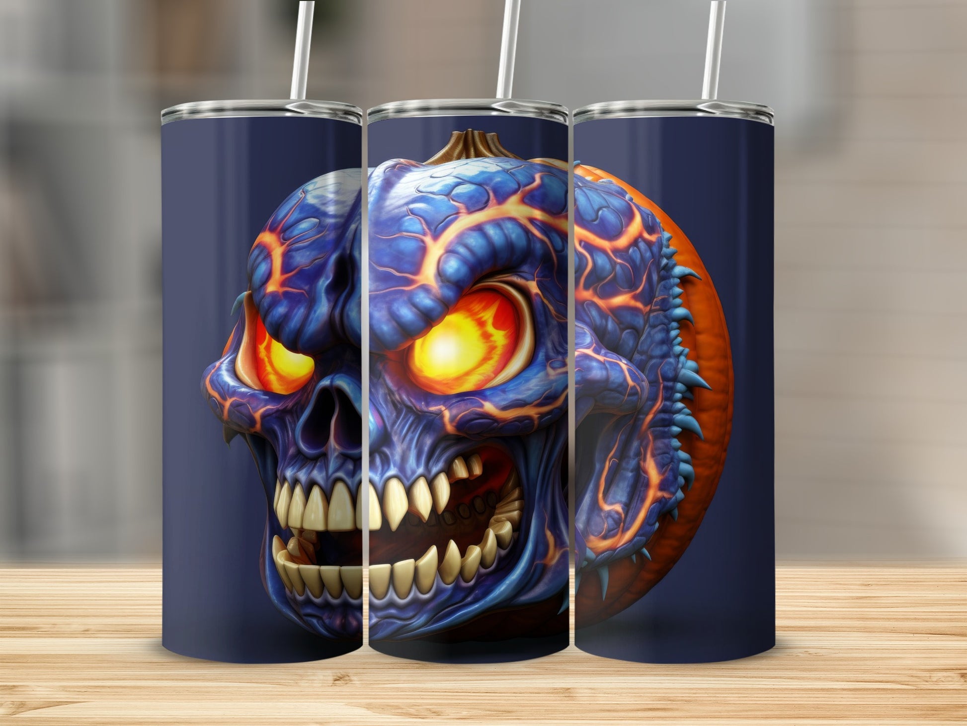 Three tumblers with a blue, fiery skull and pumpkin design.
