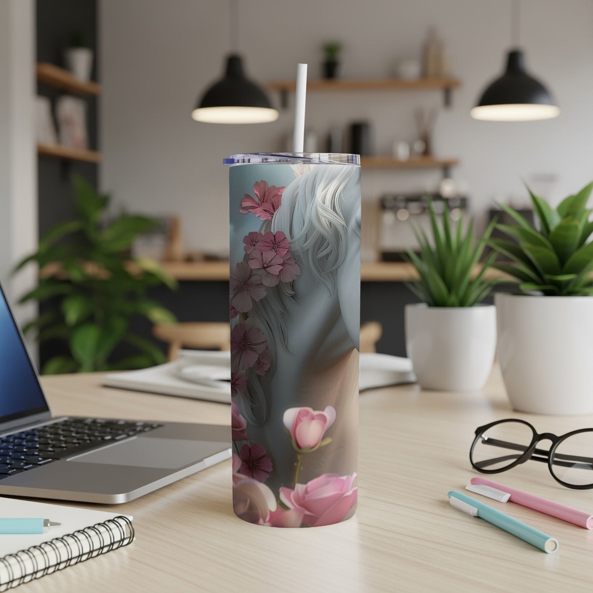 Skinny tumbler with woman's profile and pink floral design.