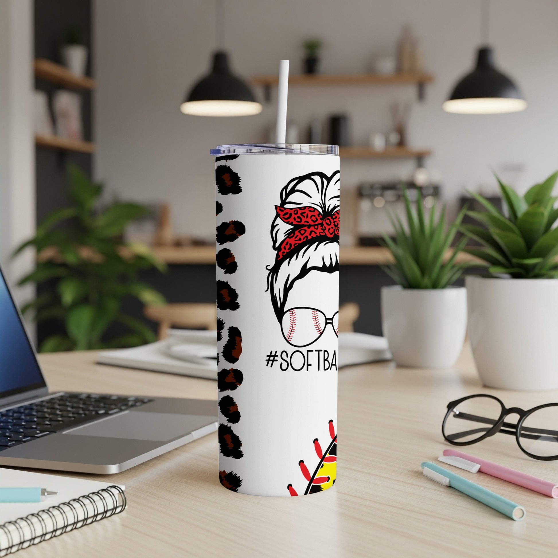 White tumbler with messy bun, leopard print, and "#SOFTBALL".