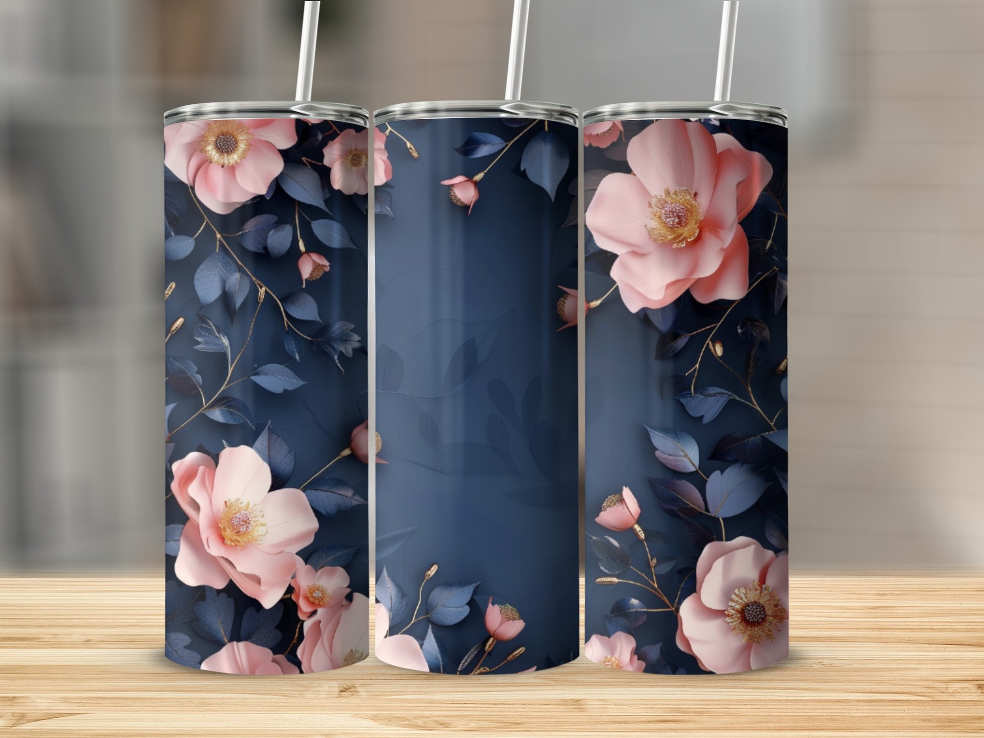 Three tumblers with pink flowers and dark blue leaves on a wooden surface.