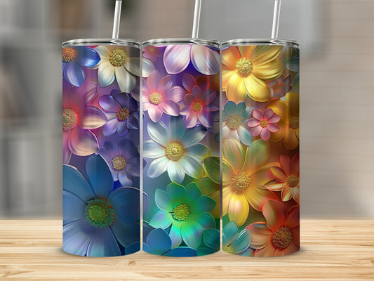 Three tumblers with colorful floral designs in blue, green, and orange.