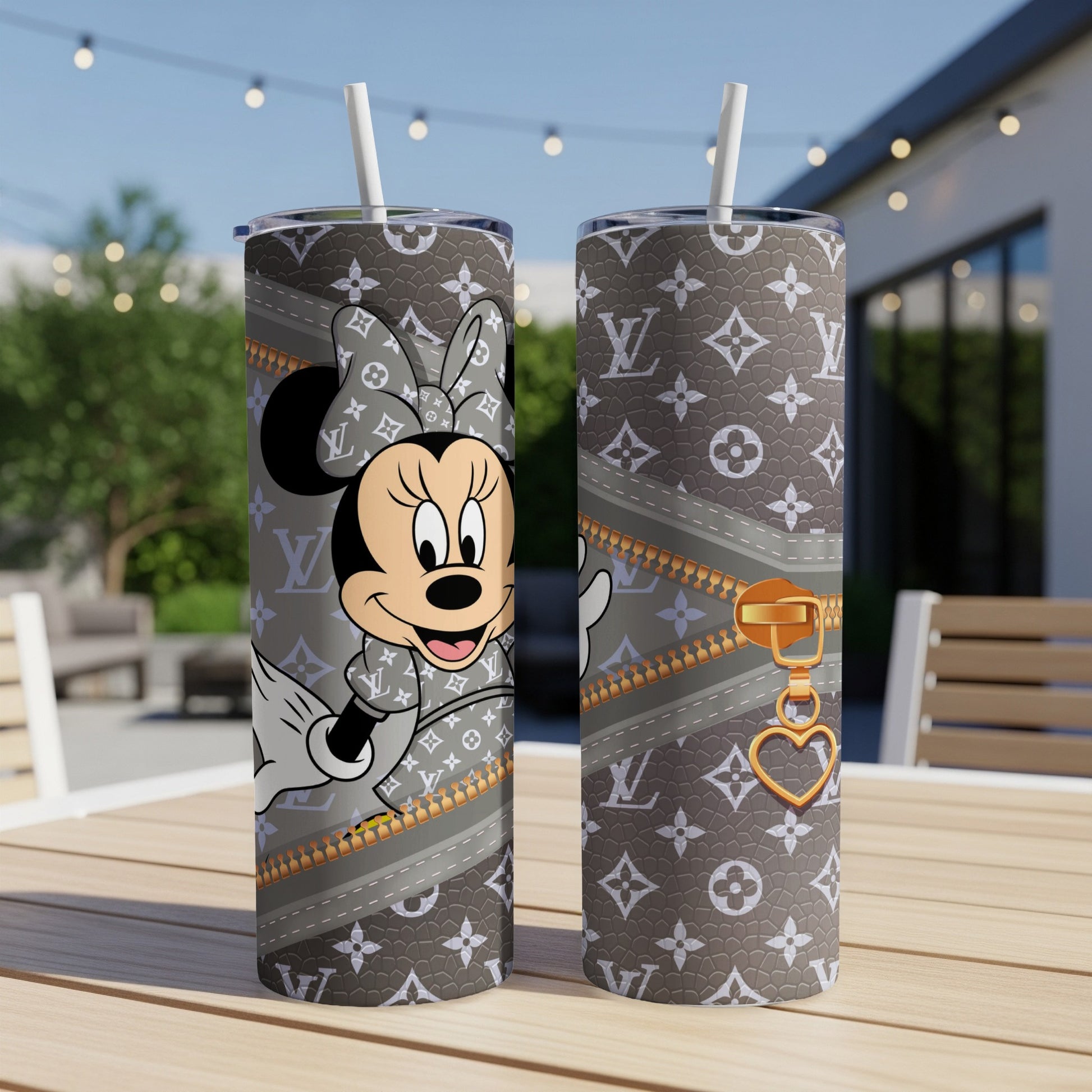 Minnie Mouse on a grey tumbler with LV pattern and gold zipper detail.