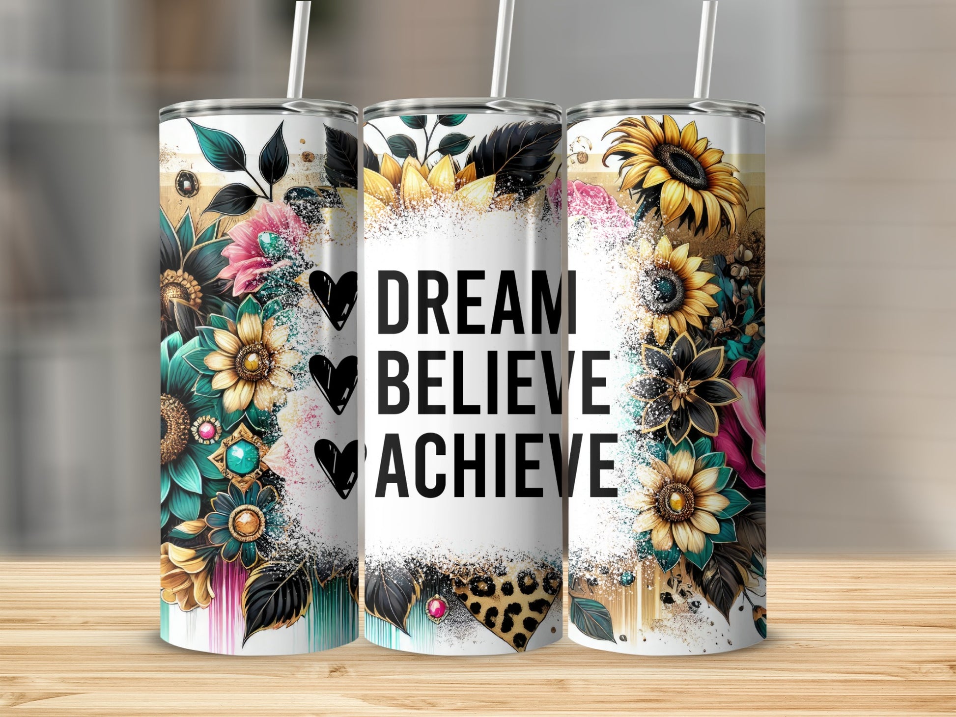 Tumbler with floral accents and "Dream Believe Achieve" text.