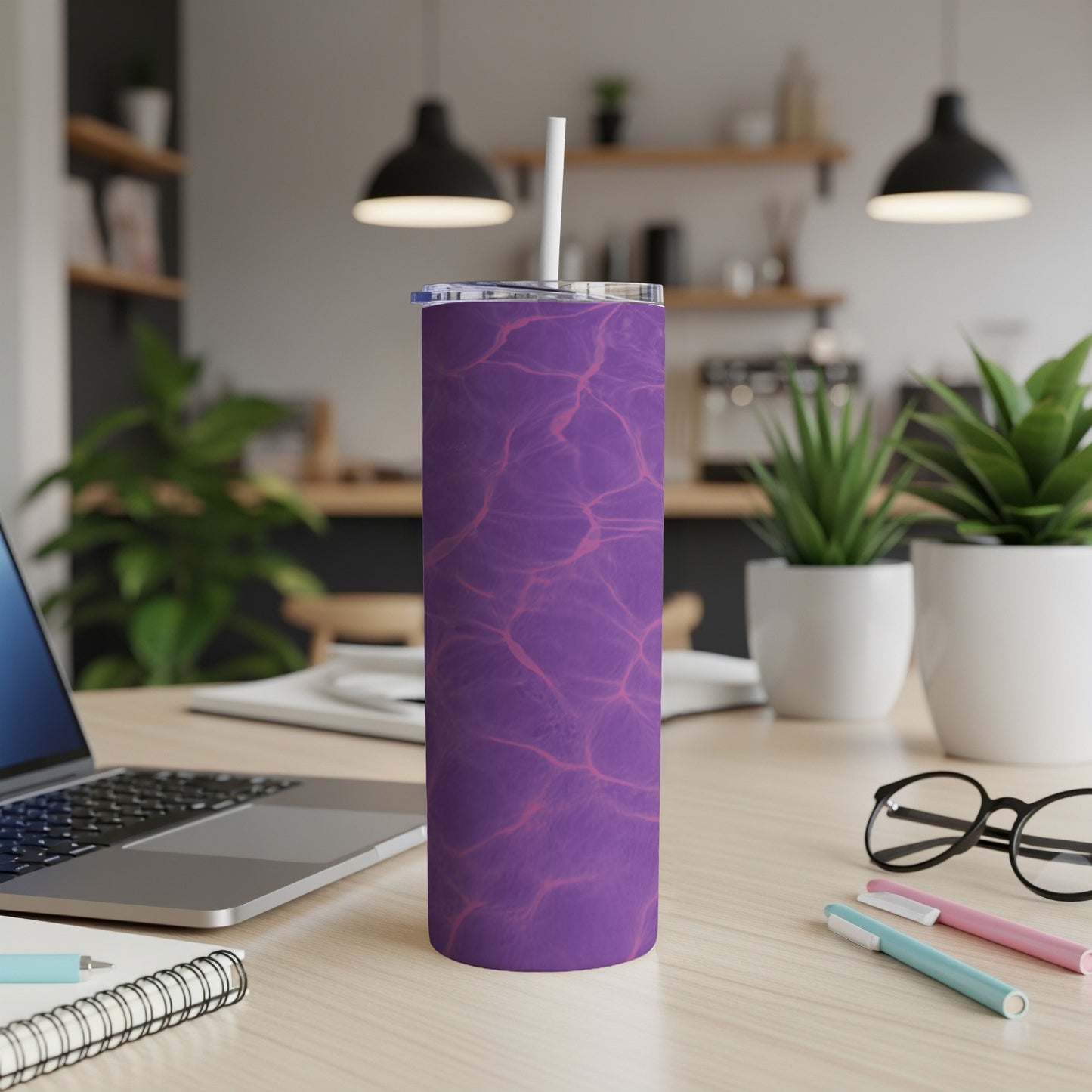 Purple abstract water pattern skinny tumbler with white lid and straw.