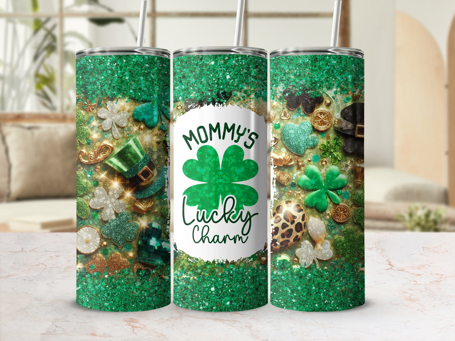 Green glitter tumbler with shamrocks, hats, and "Mommy's Lucky Charm" text.