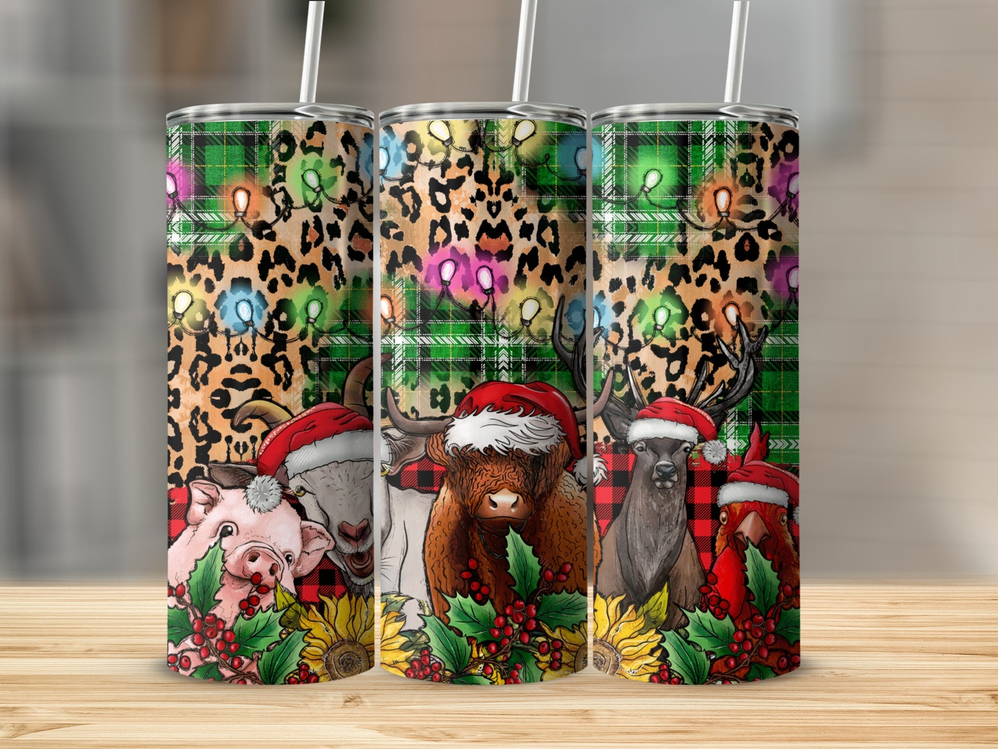 Three Christmas-themed tumblers with farm animals wearing Santa hats.