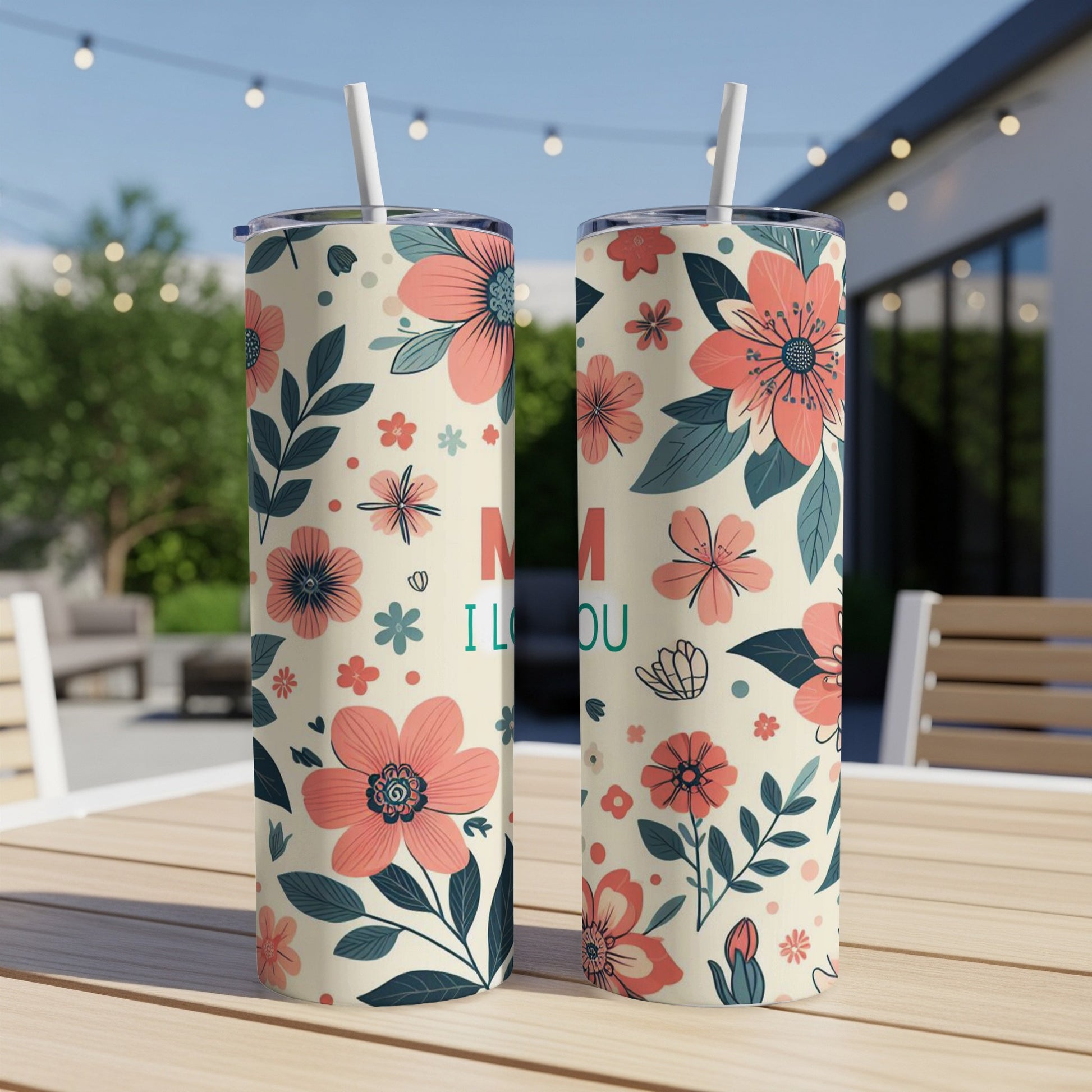 Two floral patterned tumblers with "Mom I Love You" text on a table.